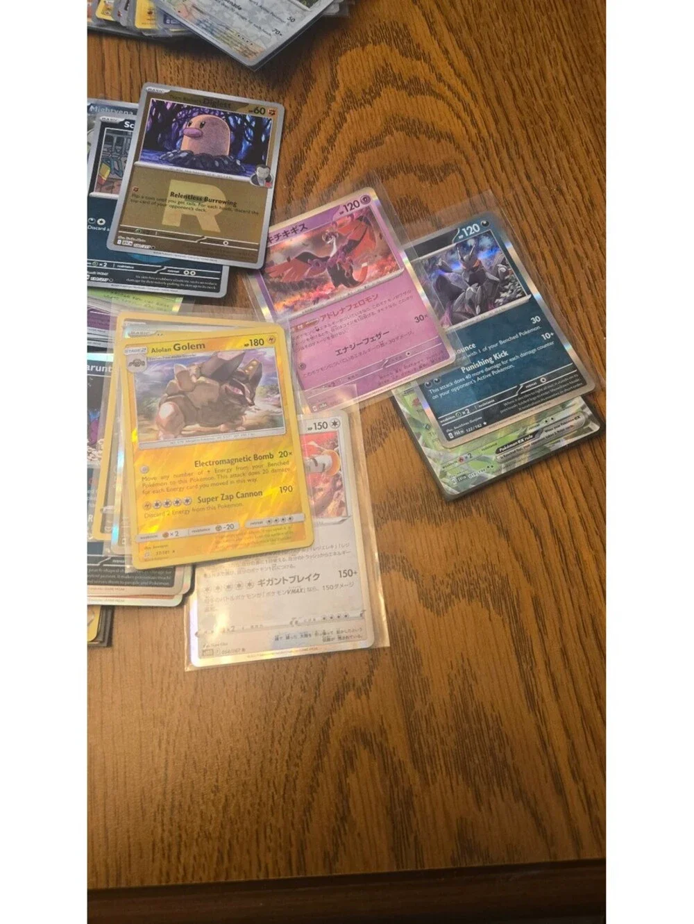 Bulk Lot of Mixed Pokemon Trading Cards with Sleeves and Storage Box
